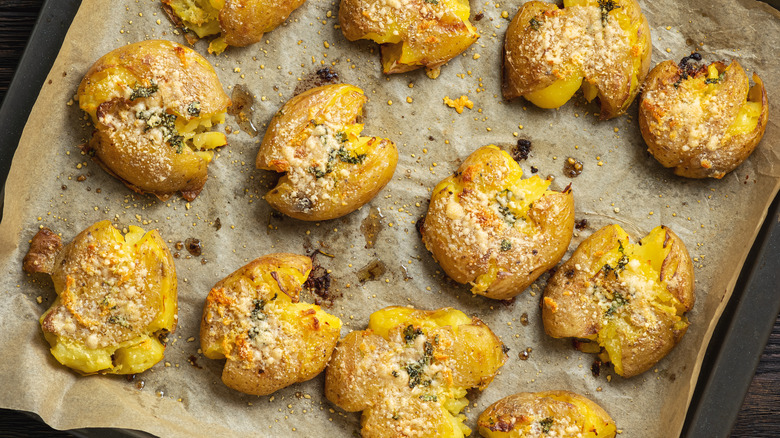 Smashed potatoes on parchment paper