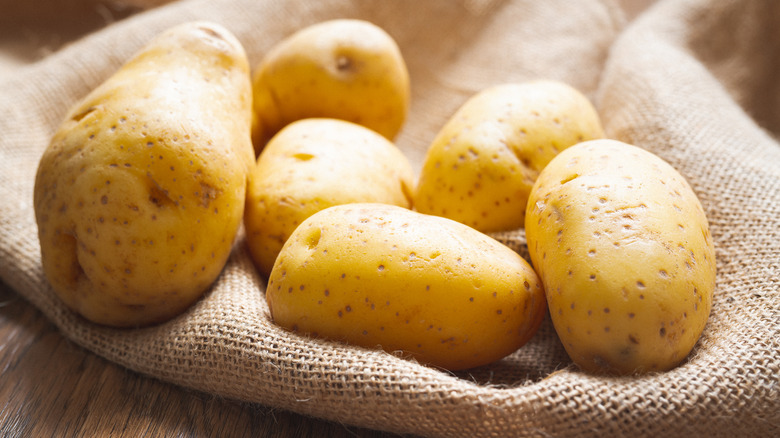 Yukon Gold potatoes on brown sack