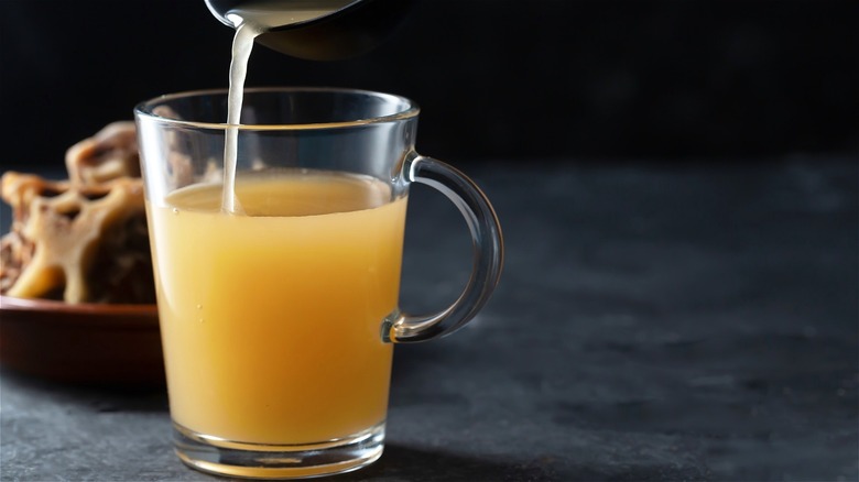 Bone broth poured into clear mug