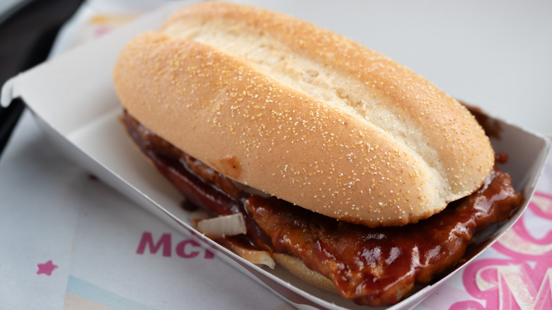 McRib sandwich in an open white tray