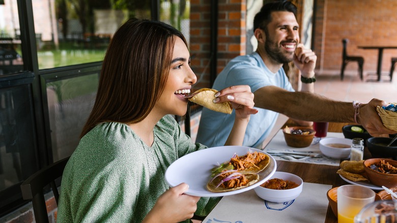 Woman eating at a dinner party