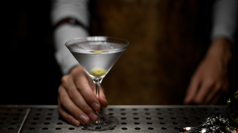 Bartender serving martini