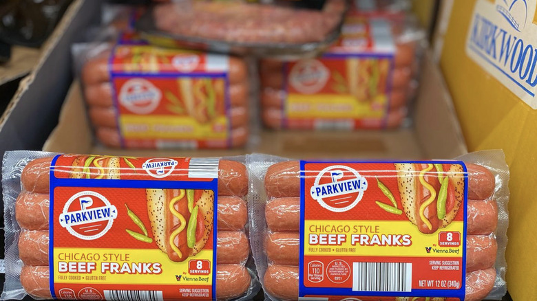 three hot dogs with buns