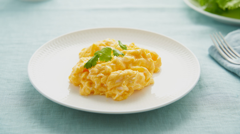 White plate of scrambled eggs