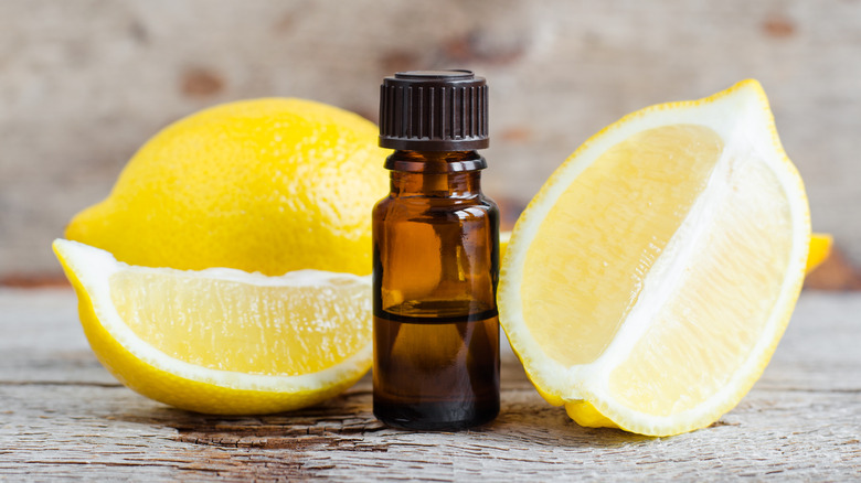 lemon oil bottle with lemons