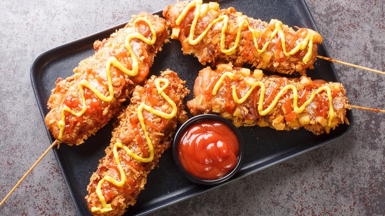 Korean corn dog with ketchup and mustard