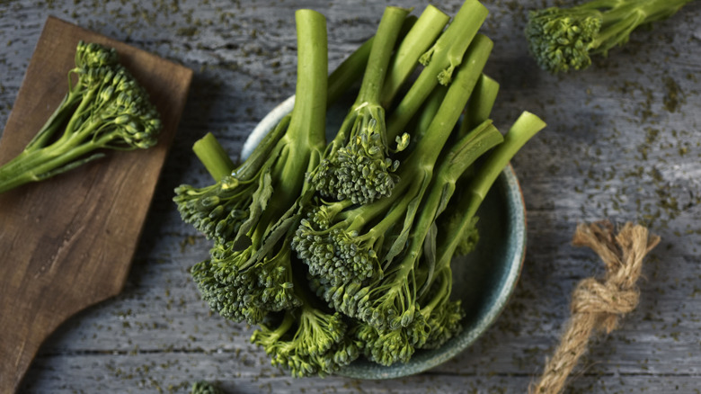 Cut up pieces of broccolini in a bowl