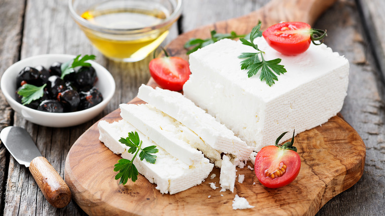 Feta cheese on wooden board