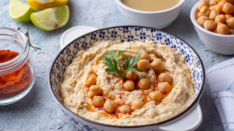 Bowl of hummus with sides