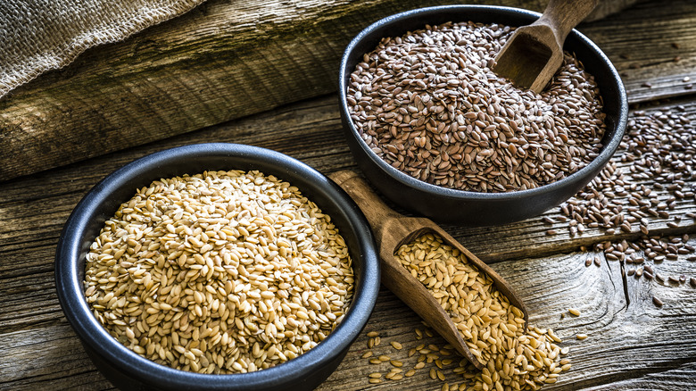 Brown and gold flaxseeds in bowls