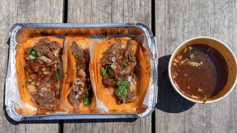 birria tacos in takeout container