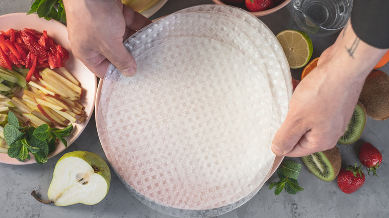 Hands holding rice paper 