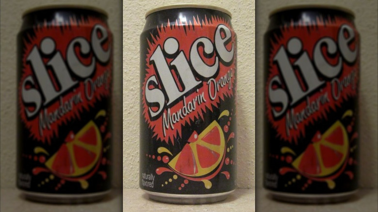 A can of vintage Slice mandarin orange on a neutral background