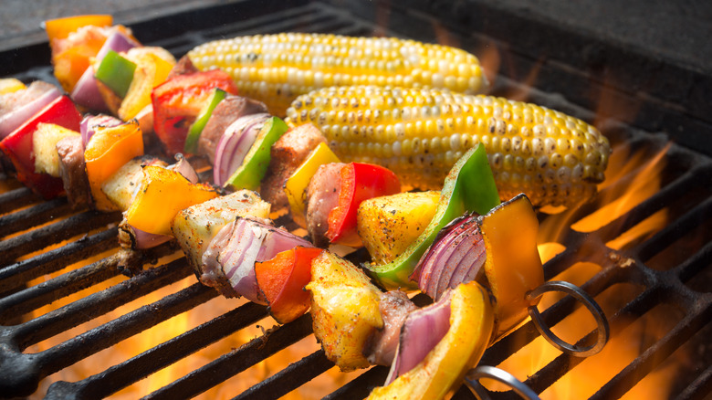 Corn and vegetable skewers on the grill
