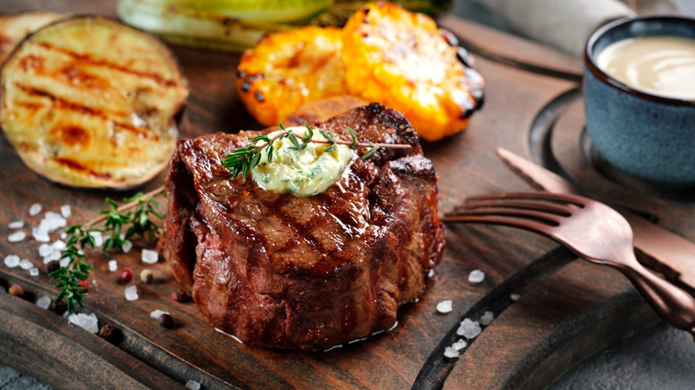 Herbed butter melting on steak