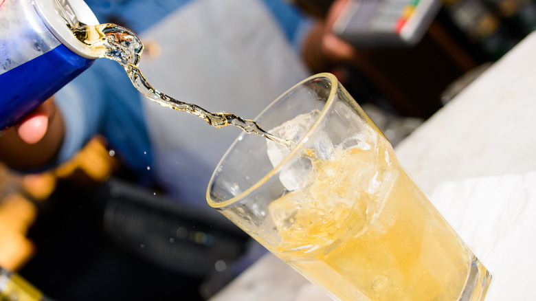 Red Bull being poured into a glass
