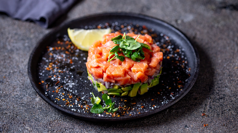 tuna tartare on a plate with avocado