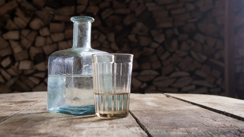 glass and bottle on table