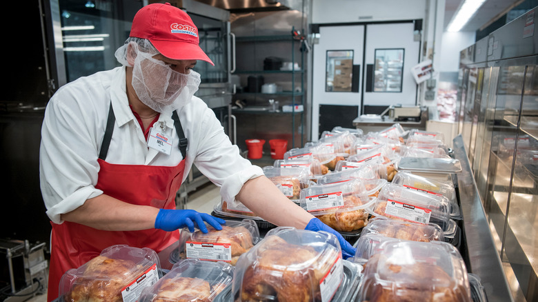 Costco employee organizing chicken
