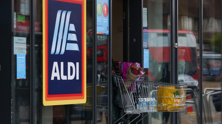 shopping cart being pushed by customer leaving aldi