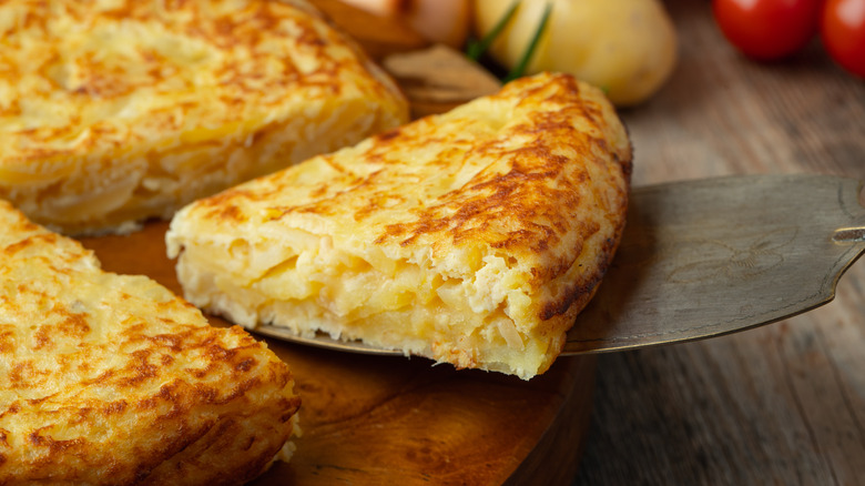 Slice of tortilla española being cut