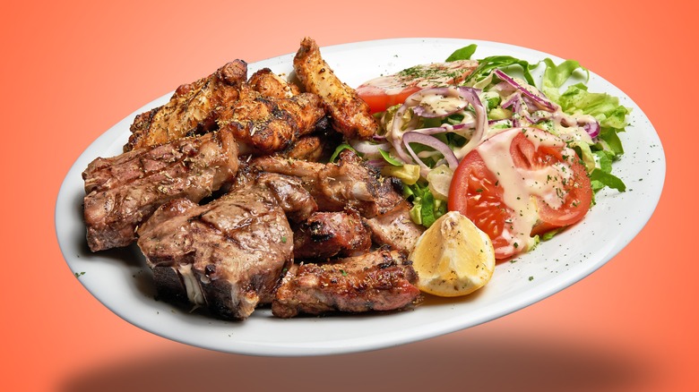 grilled pork with a side salad