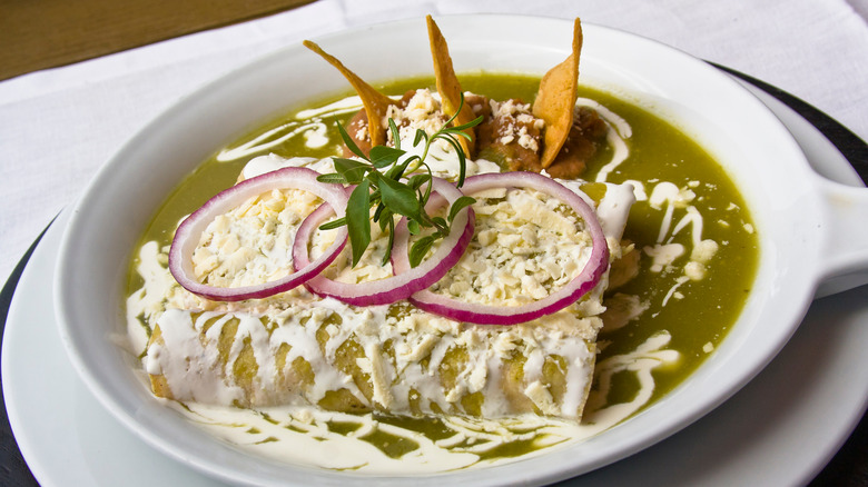 enchiladas topped with Mexican crema 