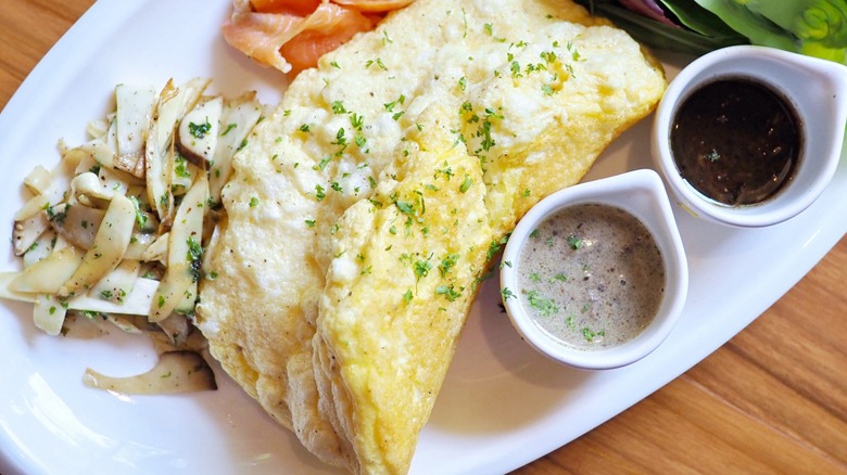 soufflé omelet on plate with sides