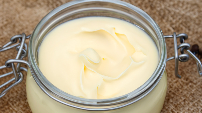 Open glass jar of beef tallow