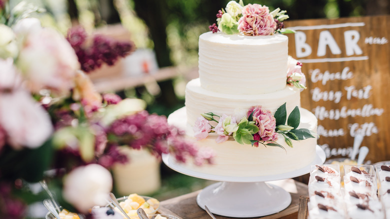 White wedding cake with roses
