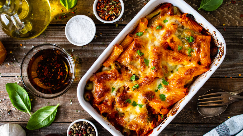 Cheesy pasta casserole on table