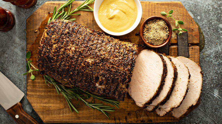 Roast pork loin on board