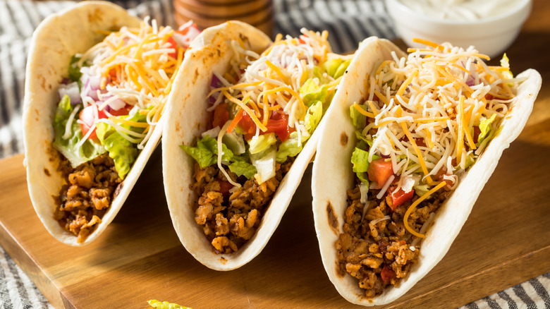 Three tacos on a tray
