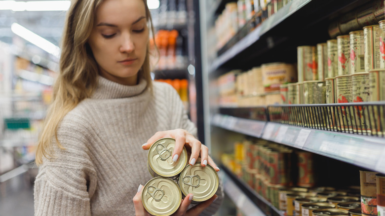 woman reading can labels