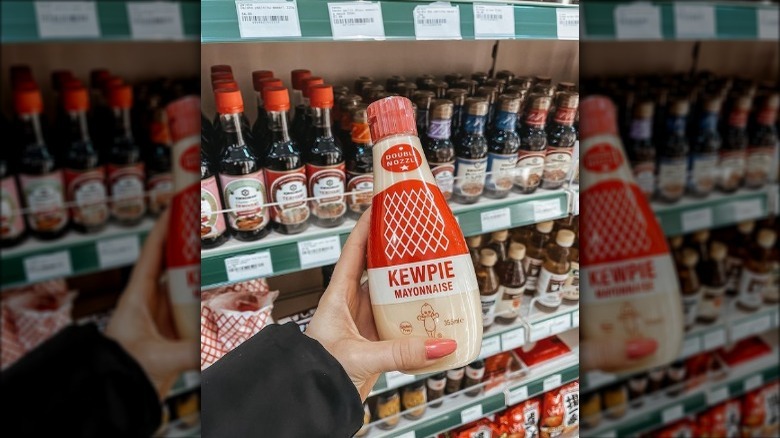 Woman holding Kewpie mayonnaise bottle