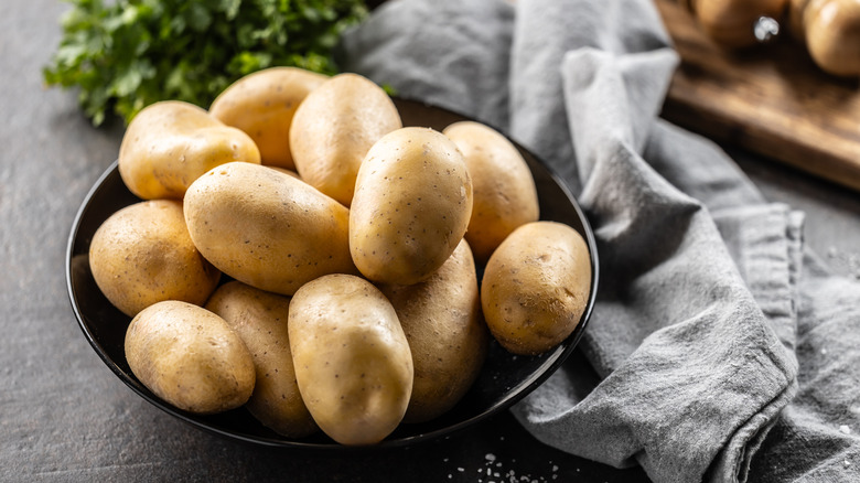 Potatoes in black bowl