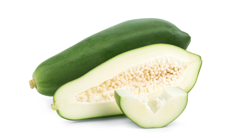 unripe papaya sliced open