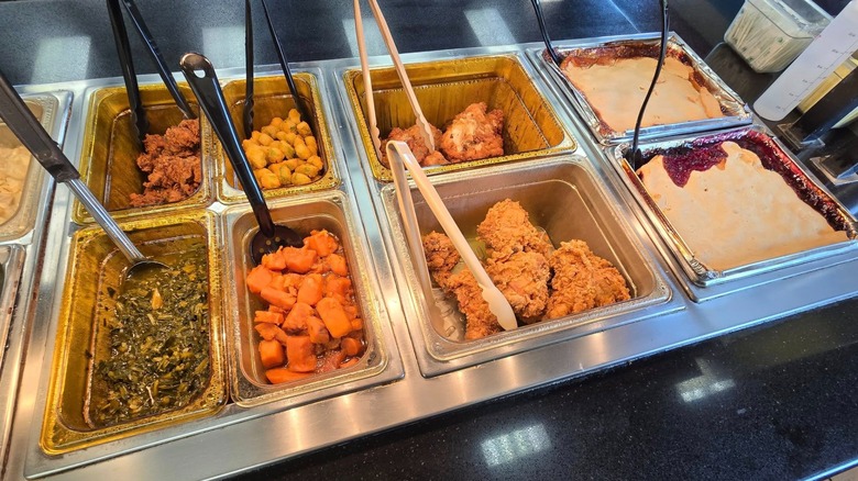 Chicken, fried okra, greens-and-spinach, cobbler, and more at a KFC buffet