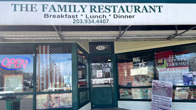 The front of The Family Restaurant classic American Diner in West Haven, Connecticut advertises its breakfast, lunch, and dinner, as well as take out service.