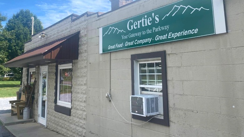 A simple sign with a mountain range drawing announces Gertie's: Your Gateway to the Parkway in Vesuvius, Virginia.