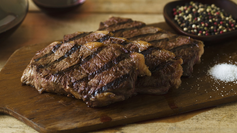 Cooked steak on cutting board 