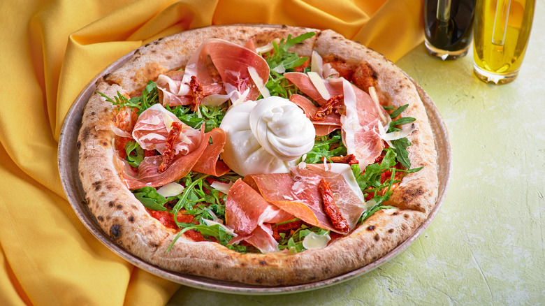 Pizza topped with burrata