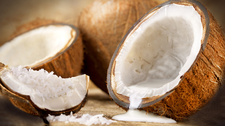 Cracked open coconut with milk