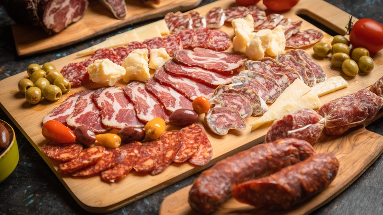 Charcuterie board with cured meats