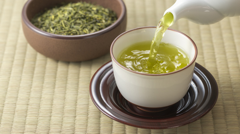 Green tea being poured