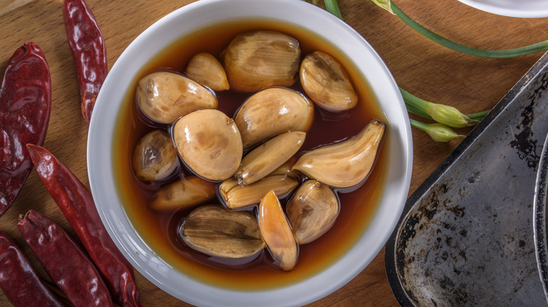pickled garlic in bowl chillies