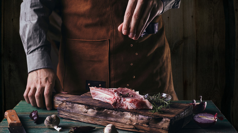 Chef salting steak