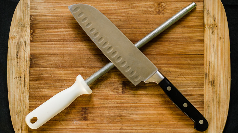 knife and honing rod wooden board 