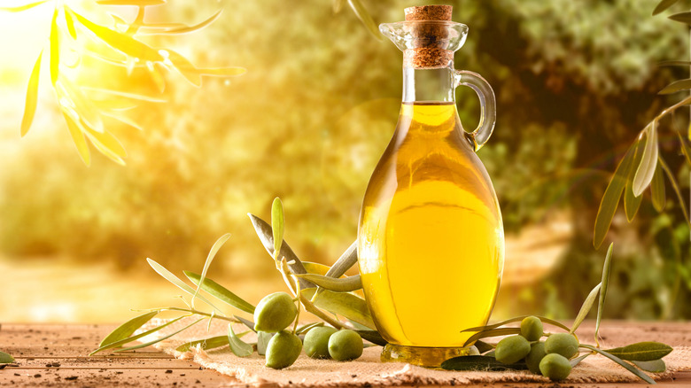 olive oil bottle and olives