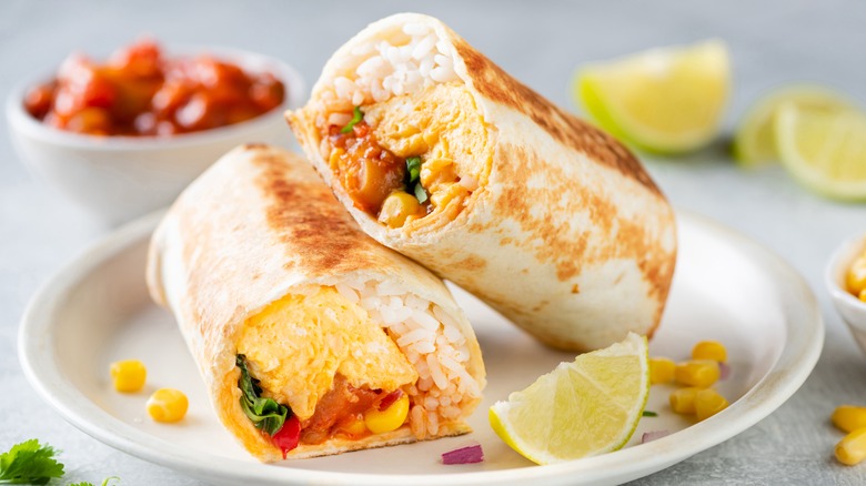 a breakfast burrito on a plate